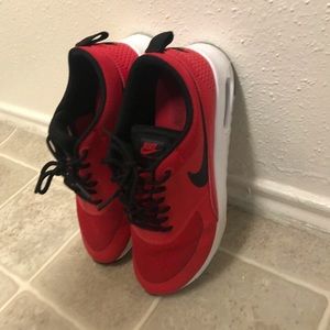 Red Nike sneakers for women, size 7, red and white